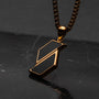 "Baritone Necklaces" necklace featuring a modern marble and gold geometric design.