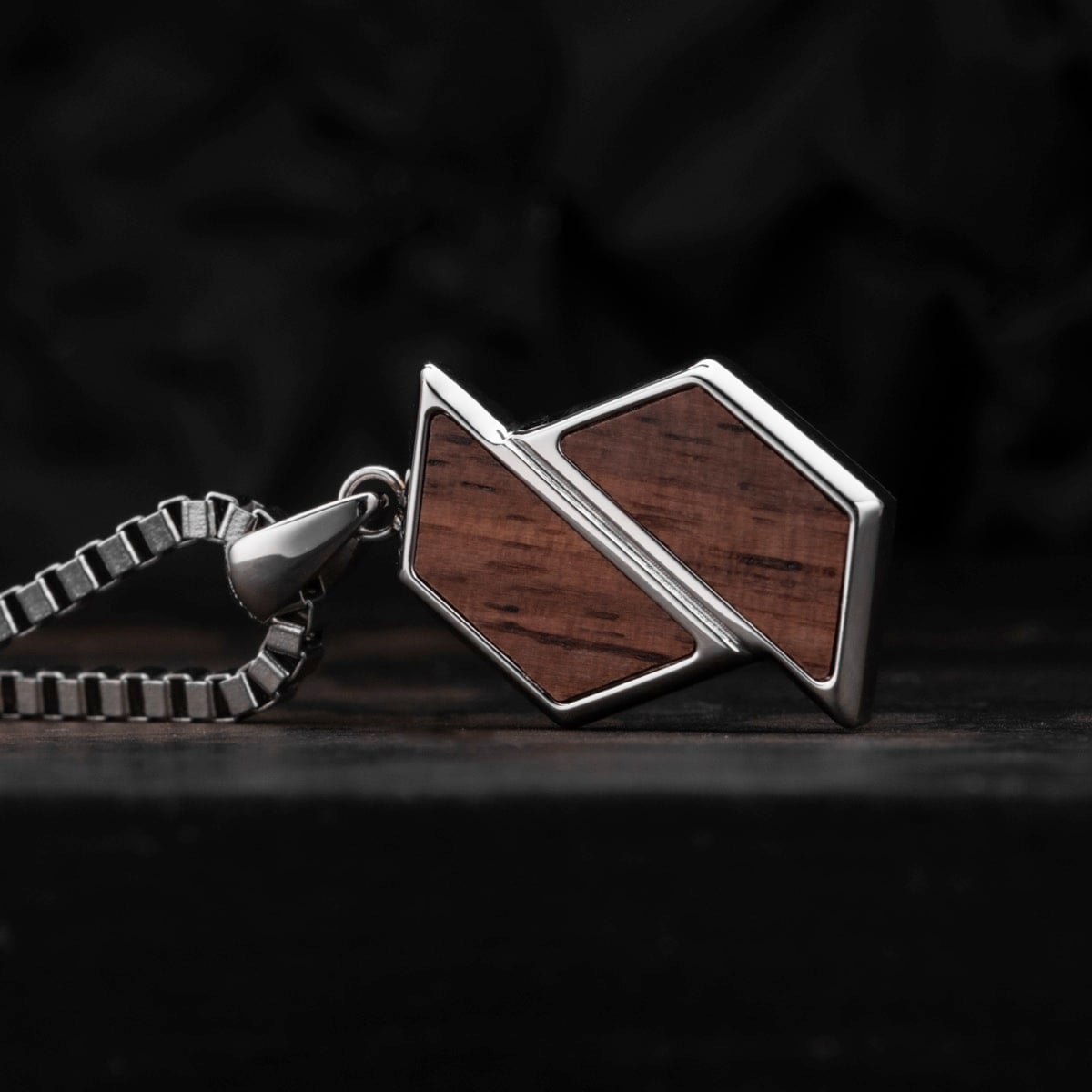 "Baritone Necklaces" - a sleek necklace combining geometric walnut and silver elements for a modern style.