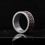 "Baritone Rings", a stylish walnut and silver ring with a modern geometric design.