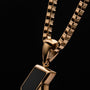 "Baritone Necklaces" necklace featuring marble and gold with a sleek, modern design.