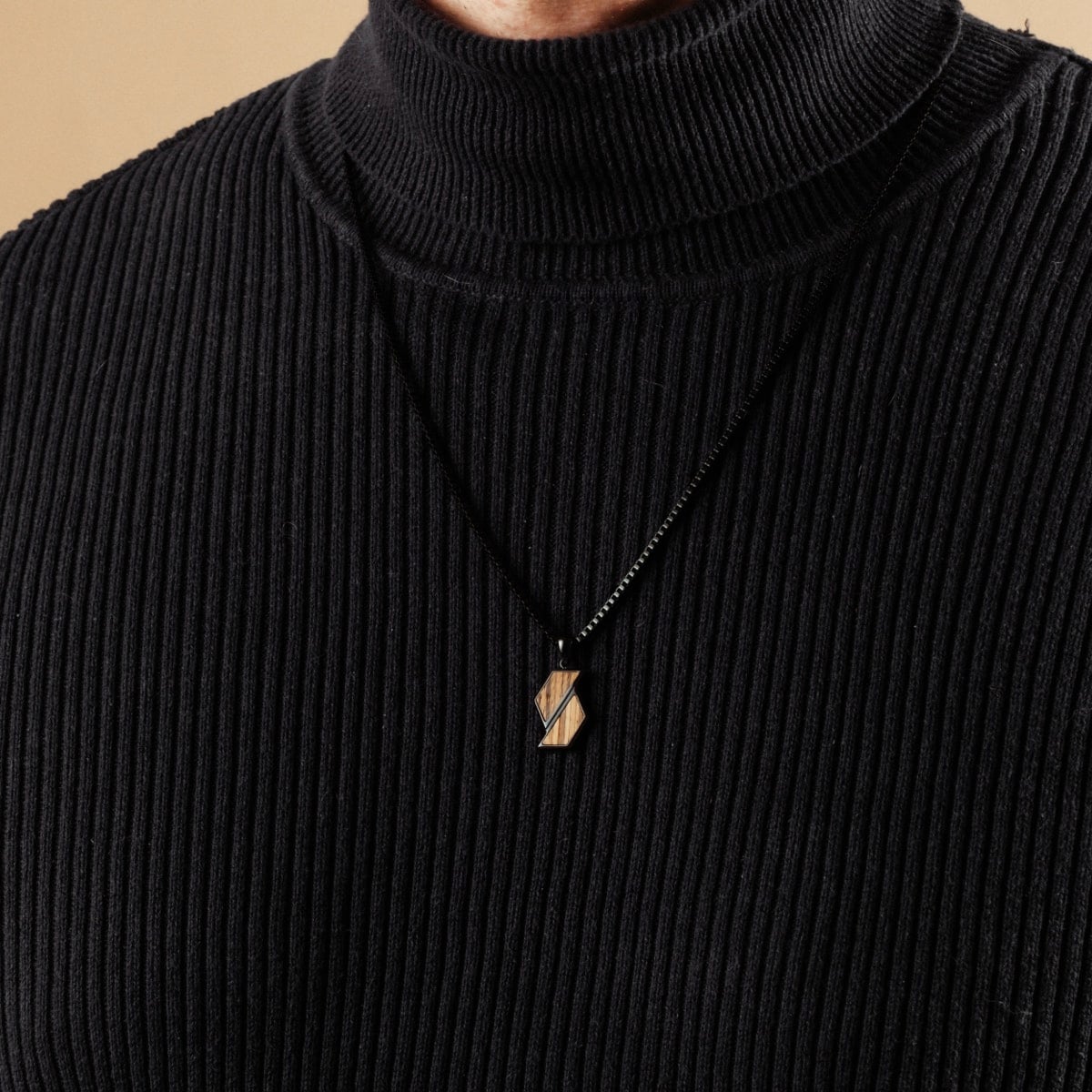 "Baritone Necklaces" necklace featuring a geometric design in zebrawood and black, offering a minimalist and elegant style.