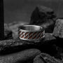 "Baritone Rings" ring featuring a sleek walnut and silver design, exuding a modern and elegant style.