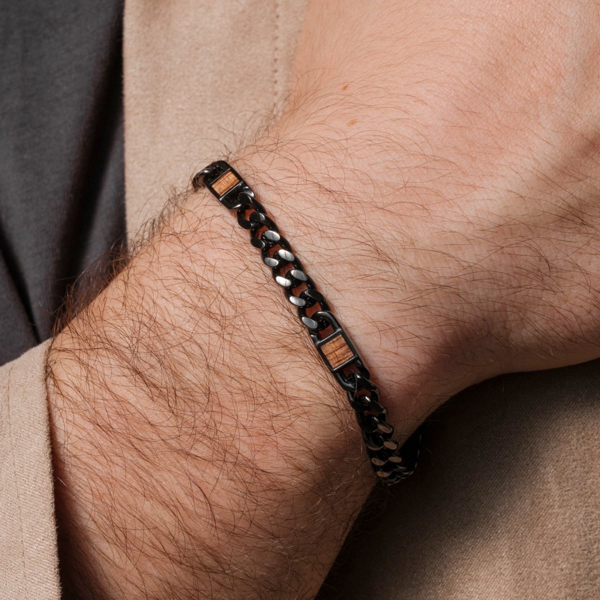 "Bodyguards Strap" bracelet with walnut and dark gray elements, featuring a sleek, modern design.