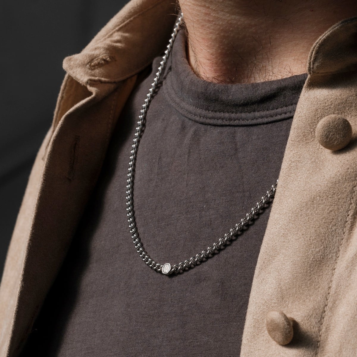 "Bodyguards Necklaces" necklace, crafted from meteorite and silver, showcased with a sleek, modern design.