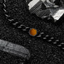 "Bodyguards Necklaces", a stylish necklace featuring Tiger's Eye and dark gray elements.