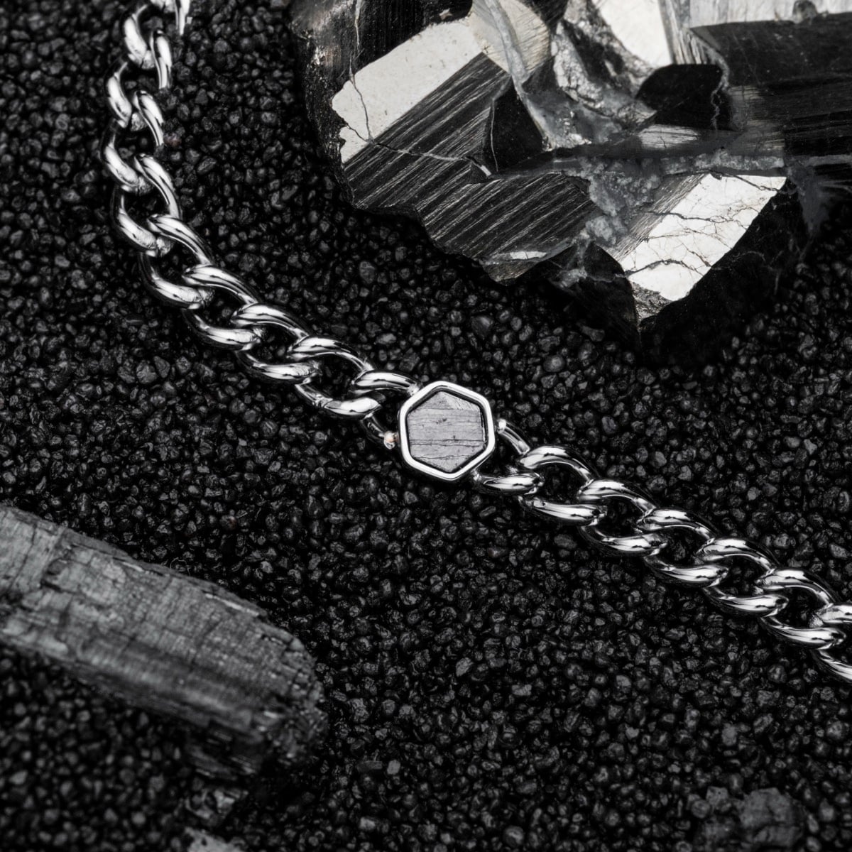 "Bodyguards Necklaces" features a sleek silver chain and meteorite accents, perfect for a modern and bold look.