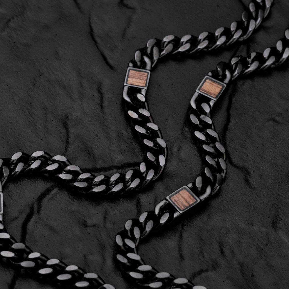 "Bodyguards Necklaces" necklace featuring walnut accents and a sleek dark gray design.