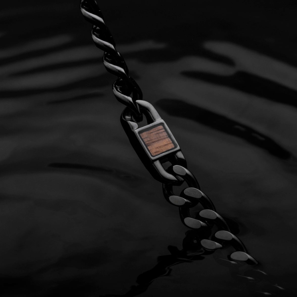 "Bodyguards Strap", a stylish wrist strap in walnut and dark gray with a sleek, modern design.