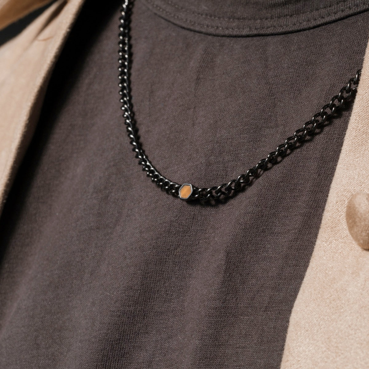 "Bodyguards Necklaces" necklace featuring Tiger's Eye in a dark gray, elegant design.
