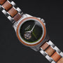 "Whisperwood" watch featuring a koa and leaf design, with a unique blend of wooden and metallic elements.
