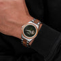 "Whisperwood" men's watch featuring a sophisticated blend of koa wood and leaf-inspired design with a stainless steel bracelet.