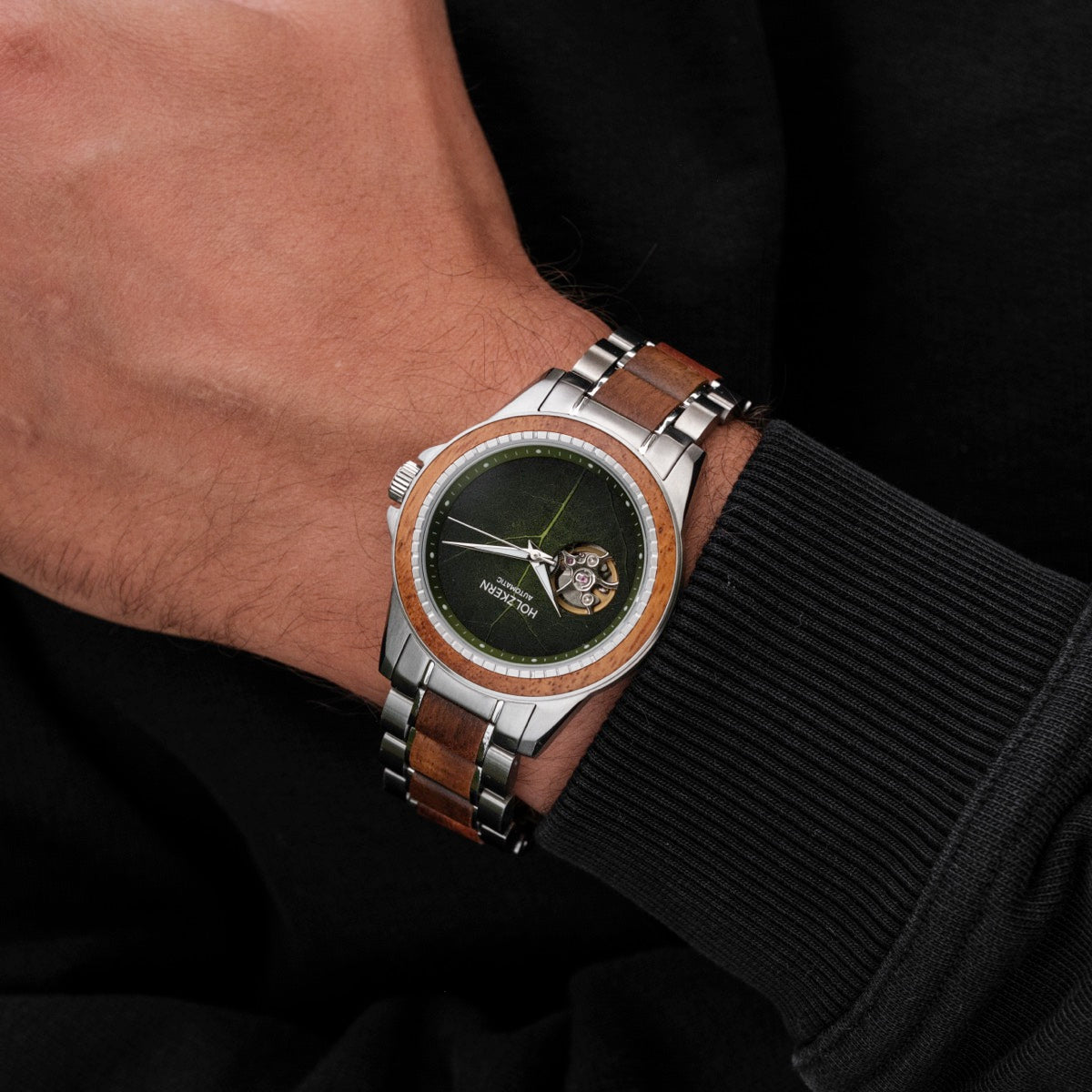 "Whisperwood" men's watch featuring a sophisticated blend of koa wood and leaf-inspired design with a stainless steel bracelet.
