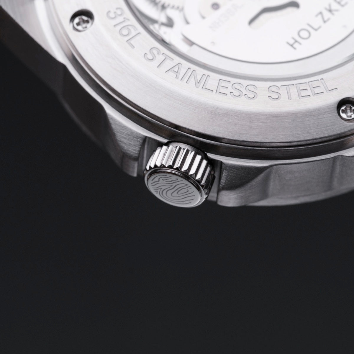 "Whisperwood" watch detail, featuring stainless steel and intricate craftsmanship with Koa and Leaf elements.
