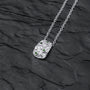 "Silverstream Necklace is a stylish silver necklace featuring green diopside stones on a textured pendant design."