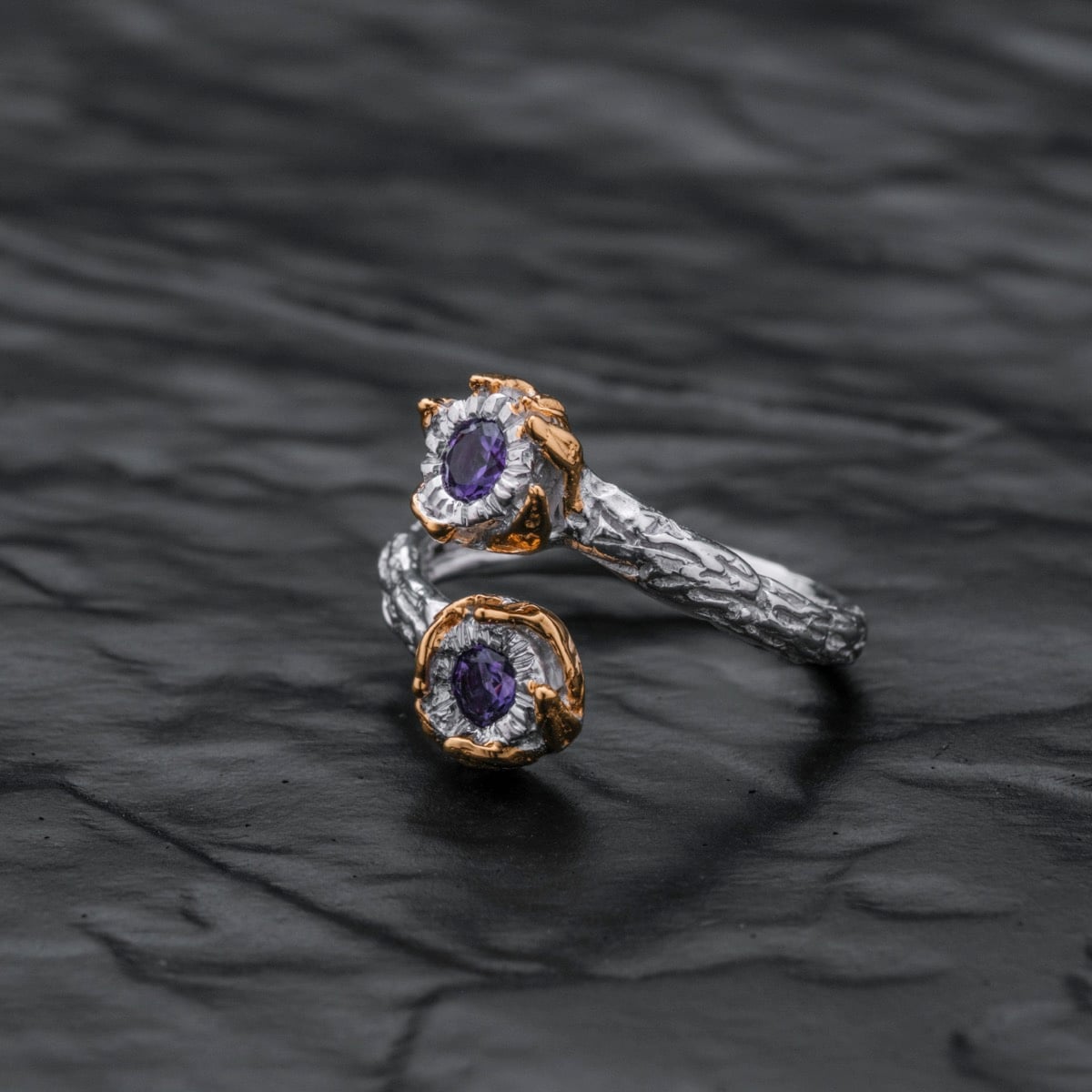Silverstream Ring: an elegant silver ring with amethyst stones and gold accents, featuring a unique textured design.