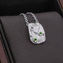 "Silverstream Necklace: A textured silver necklace adorned with green diopside stones."