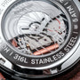 "Gmt Skywhirl" watch, showcasing intricate marble and black design elements.