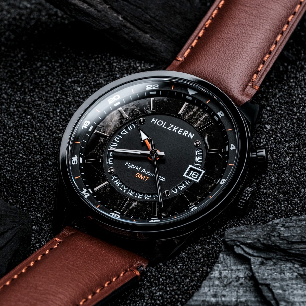 "Gmt Skywhirl", a marble and black themed hybrid automatic watch with a brown leather strap.
