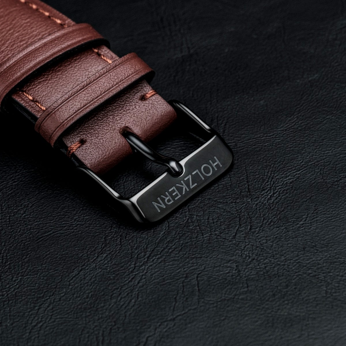 Gmt Skywhirl Leather strap in marble black style with polished buckle.