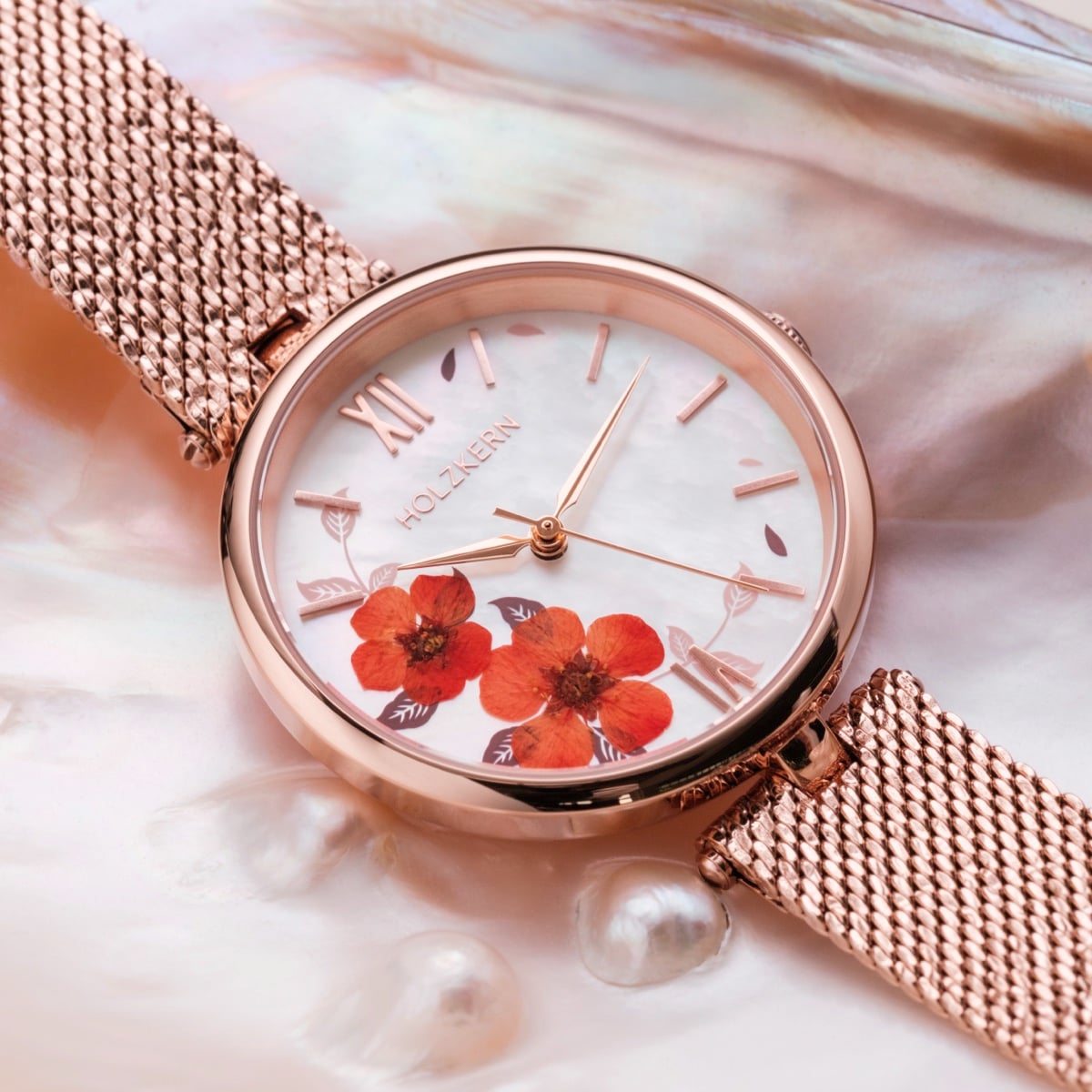 "Everbloom" watch in a plum blossom and rose gold design with intricate floral details on the dial.