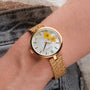 "Everbloom" watch featuring a delicate floral design and elegant gold accents.