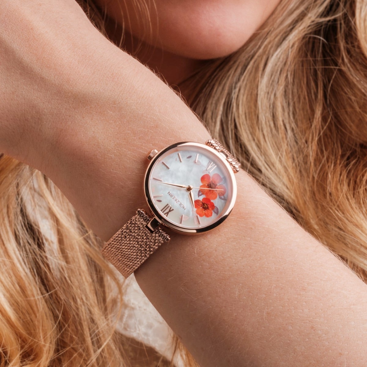 "Everbloom" watch featuring a rose gold finish and plum blossom design, blending elegance with a floral theme.