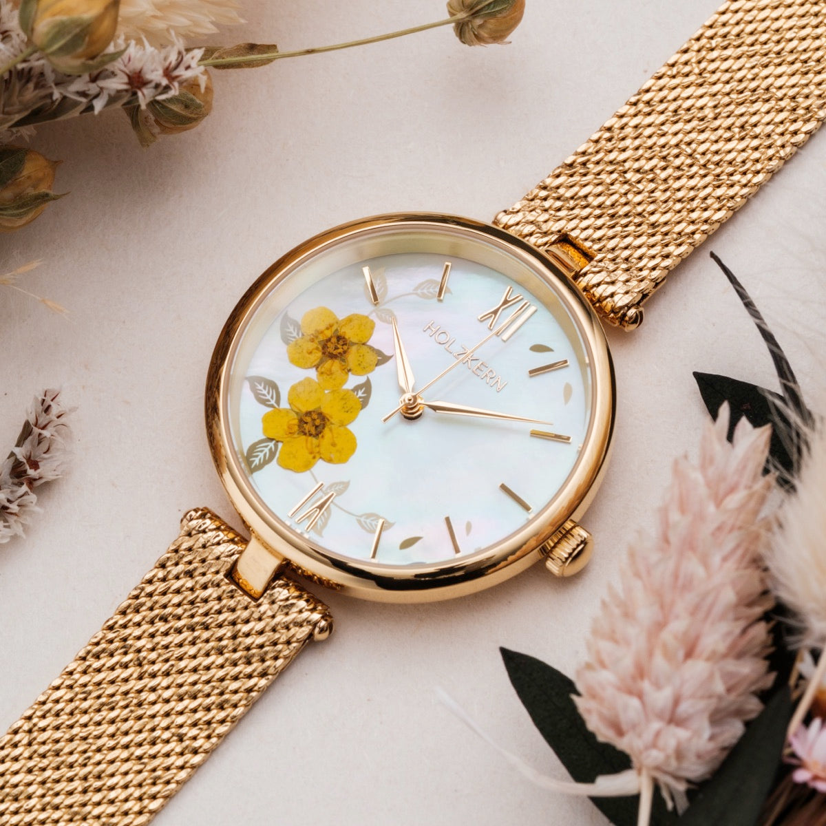 "Everbloom" watch featuring floral design, gold accents, and elegant style.