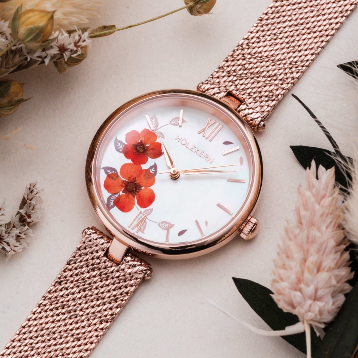 "Everbloom" wristwatch with floral design, rose gold accents, and plum blossom motif.