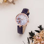 "Everbloom" wristwatch featuring floral design with plum blossom and violet accents.