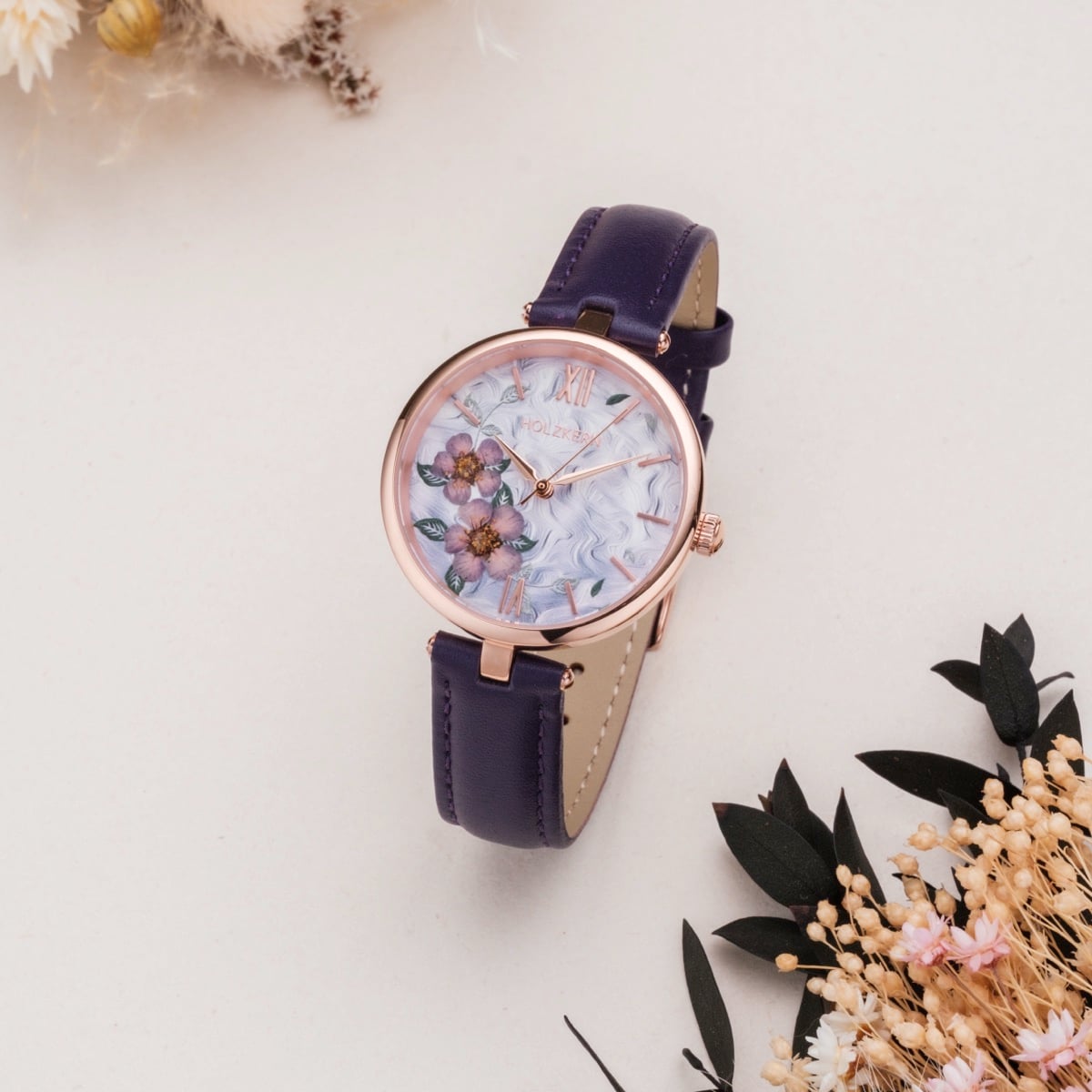 "Everbloom" wristwatch featuring floral design with plum blossom and violet accents.