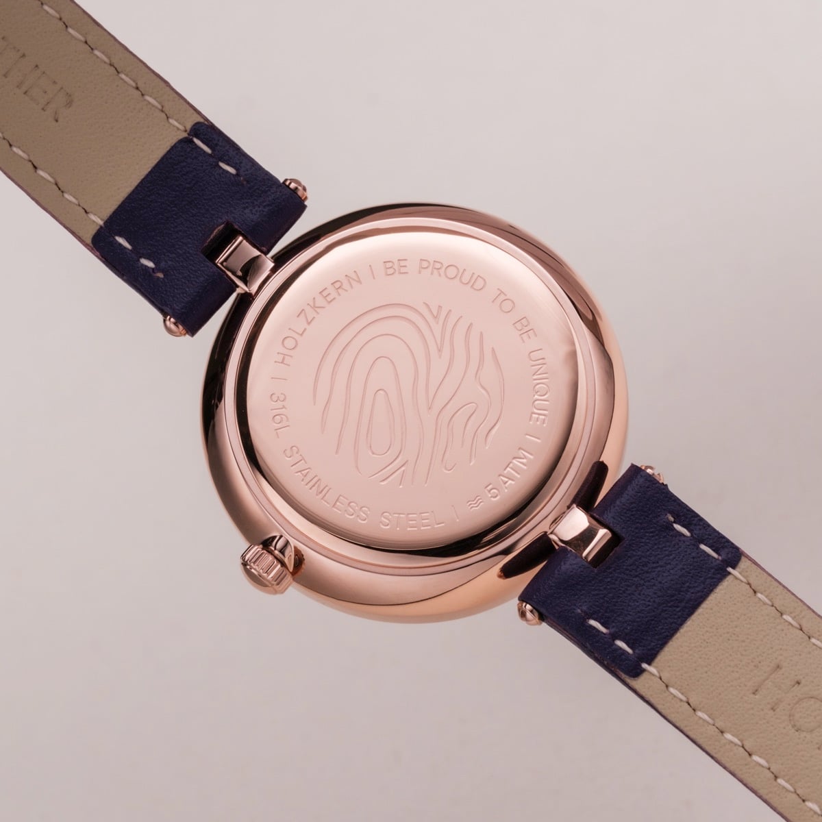 "Everbloom" watch, elegant style with plum blossom/violet hues and a stainless steel back.