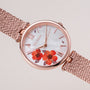 "Everbloom" watch with plum blossom design and rose gold mesh strap.