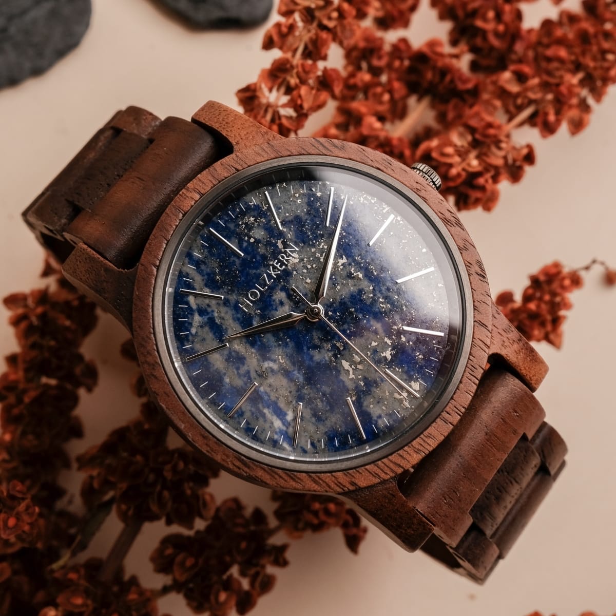 "Summer Evening" wristwatch features a walnut wood band and lapis lazuli dial, offering a sophisticated, earthy style.