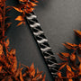 "Baritone", a dark grey accessory with maple elements, featuring an elegant geometric design.