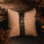 "Tremolo", a stylish black and zebrawood accessory, displayed on a textured background.