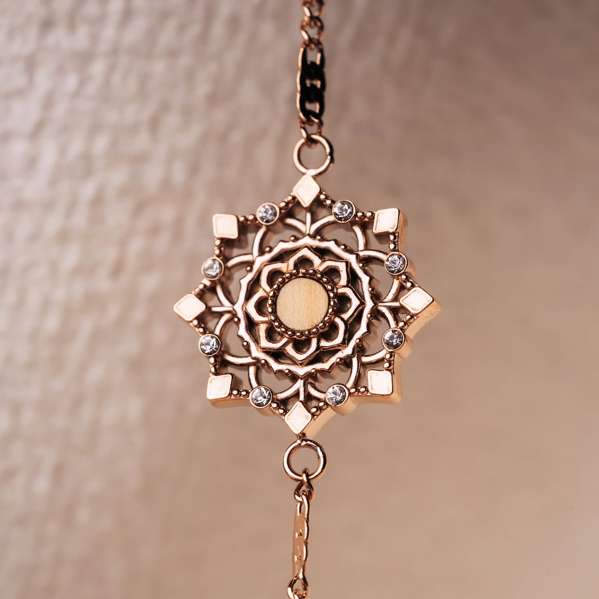 "Aphonia Bracelet" bracelet in olive and rose gold featuring an intricate, ornate design.