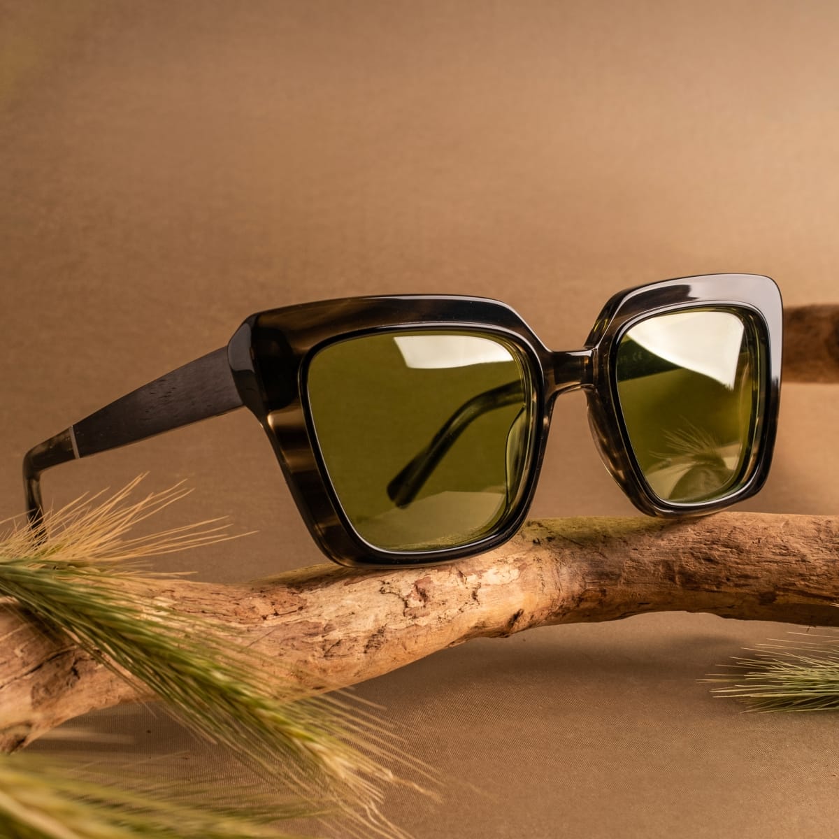 "The Exquisite sunglasses, featuring leadwood and khaki dust materials with a bold, earthy style."