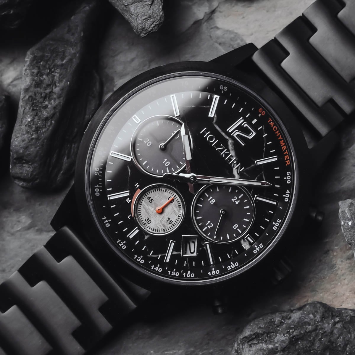 "Rahotu" watch featuring a marble and black design with a sleek, modern style.