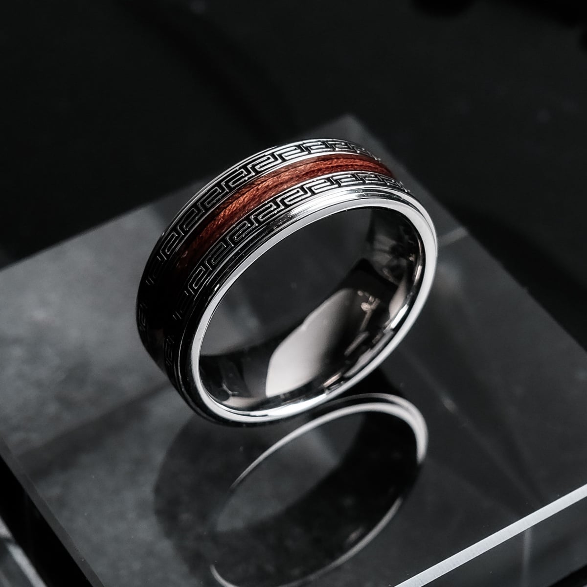 "Numerary Ring" ring, featuring koa wood and silver, with a sleek, modern design.