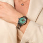 "Colorburst" watch featuring a nacre dial and walnut accents, exuding a stylish and elegant visual appeal.