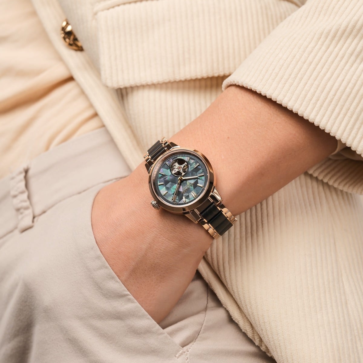 "Luminaire" wristwatch with a nacre face and maple accents, elegantly designed for a modern look.