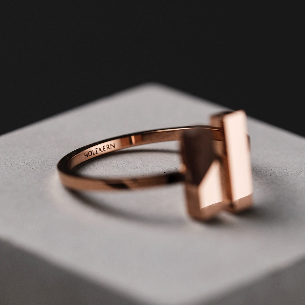 "Campania Ring" - Elegant walnut and rose gold ring, sleek modern design.