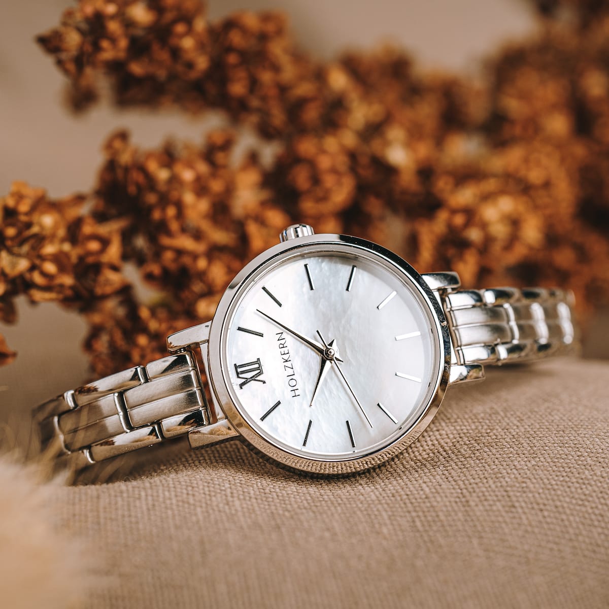 "Skadi" watch featuring a nacre dial and silver accents, showcasing elegant and timeless design.