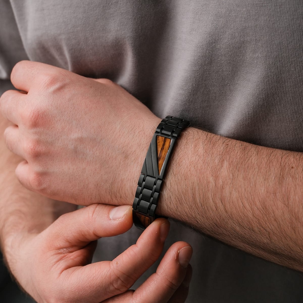 "Looper" men's bracelet with zebrawood and black design, showcasing a sleek, modern style.
