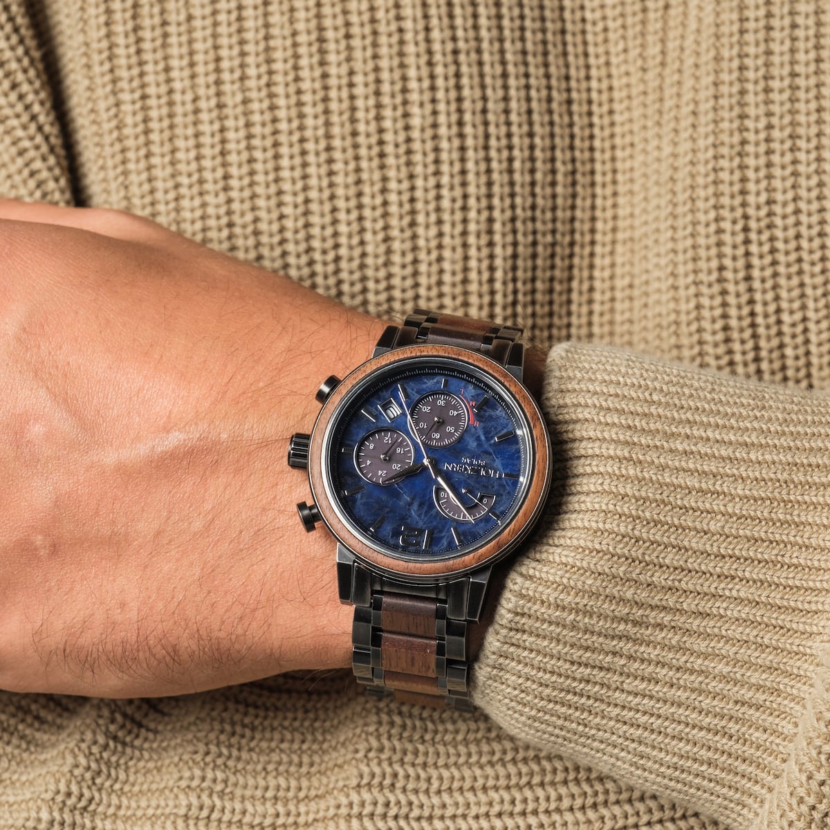 "Syntonize" watch featuring a sodalite dial and walnut accents, showcasing an elegant and refined style.