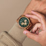 "Canopy" watch, crafted with Zebrawood and Marble, featuring a striking green dial and elegant design.