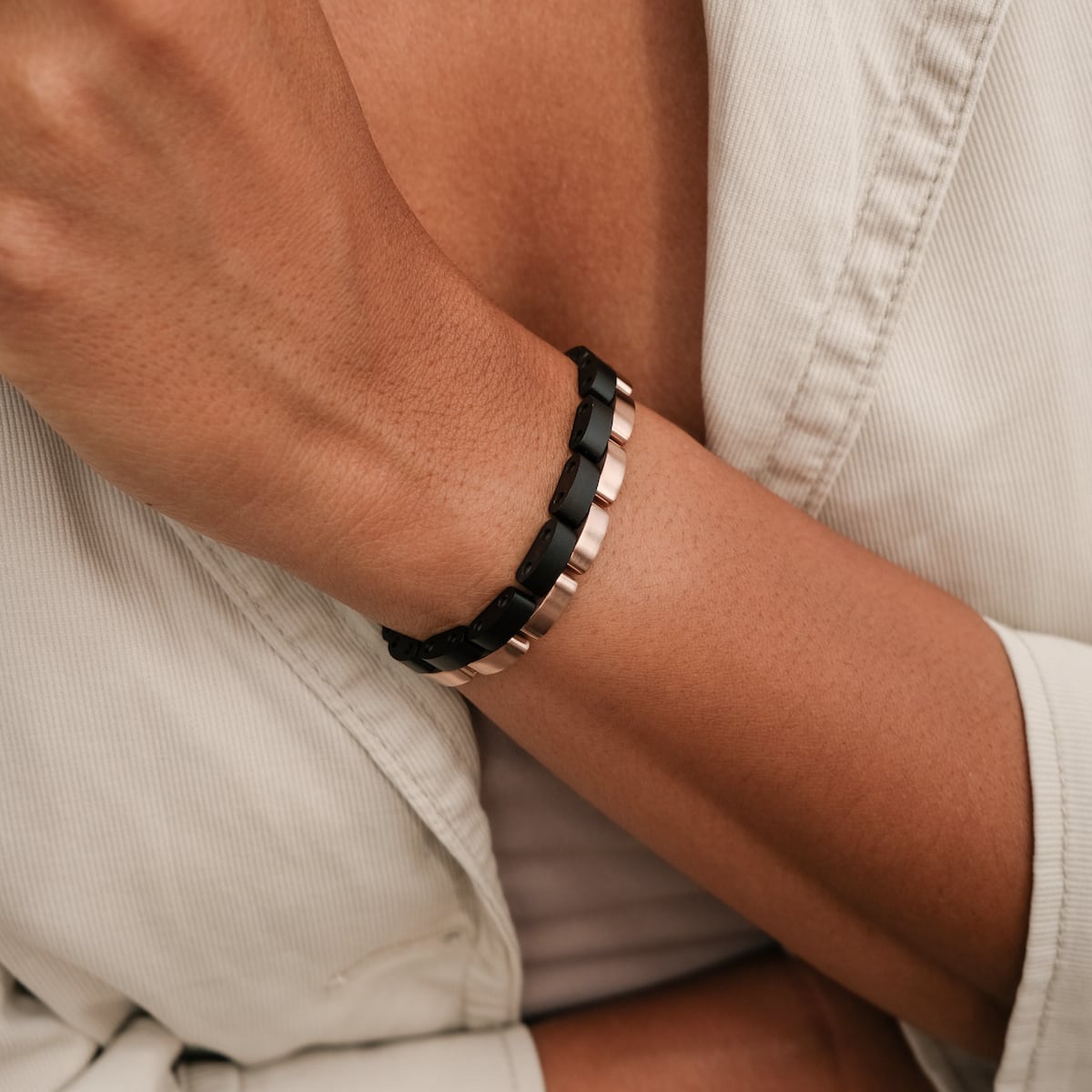 "Duet" bracelet featuring a sleek maple and rosegold design on a wrist.