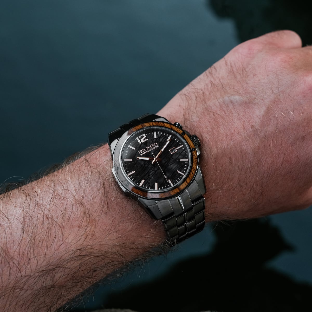 "Frostheave" watch featuring marble and zebrawood design, worn on the wrist for a sophisticated and stylish look.