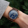 "Summer Evening" watch features a walnut band with a lapis lazuli dial, showcasing an elegant and natural design.
