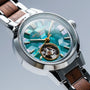 "Colorburst" wristwatch featuring a nacre face and walnut accents with a geometric design.